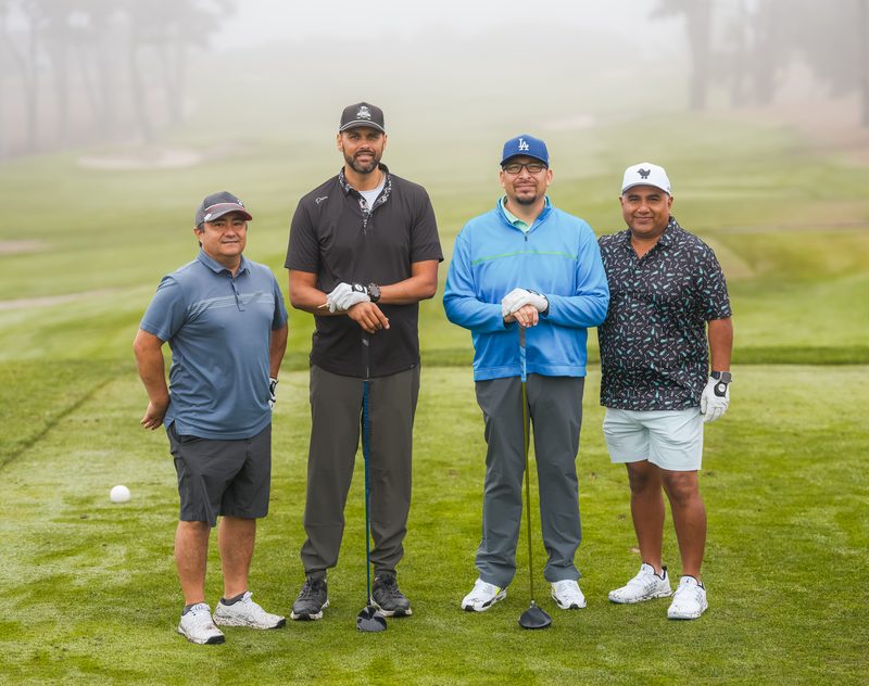 Drivers in hand and ready to go as the fog softens the fairway