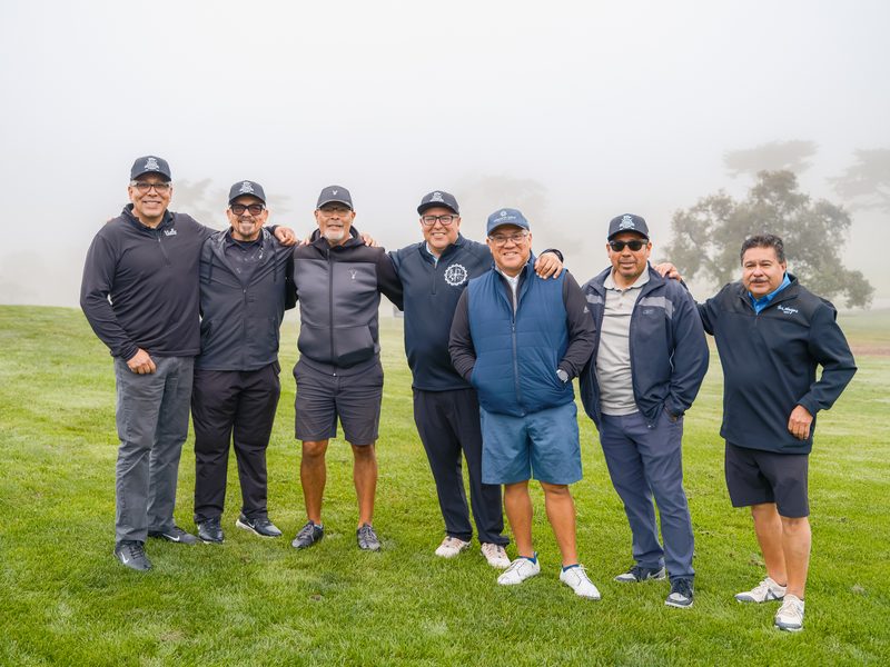 Seven brothers arm in arm as the fog rolls through